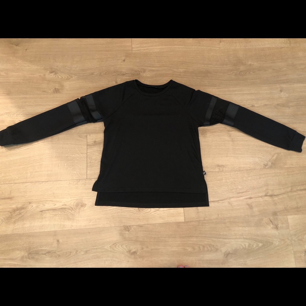 Black long sleeve with mesh panels. Kids large